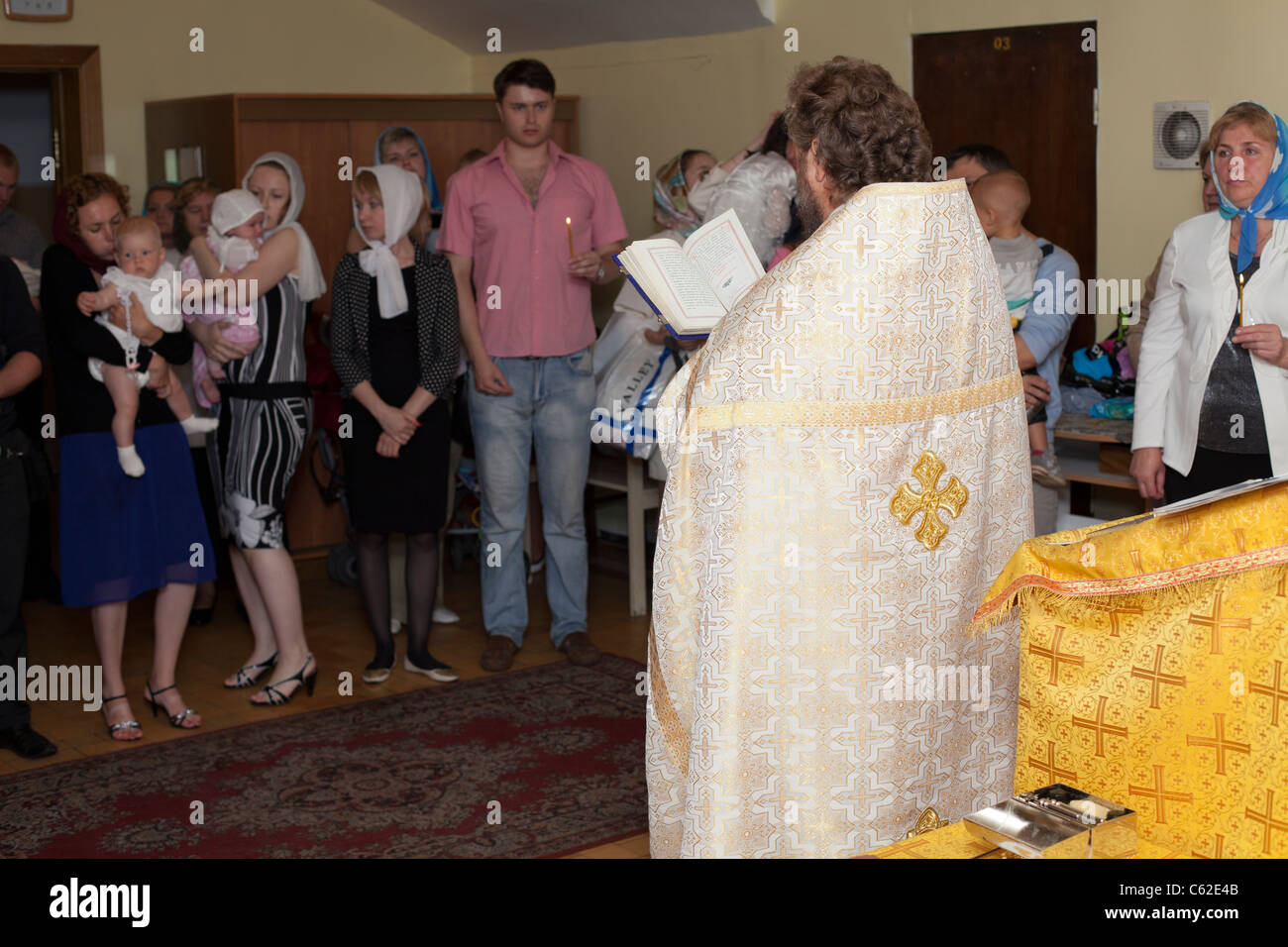 Baptism in Russian orthodox church. Priest christening the all people