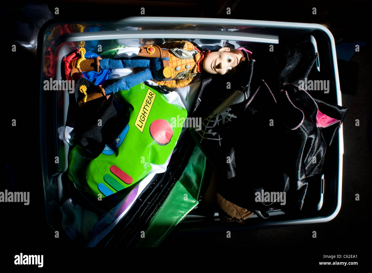 toy box with woody and buzz lightyear outfit,Woody, cowboy, hero, heroic, “toy, story”, child’s, toy,background, box, childhood, Stock Photo