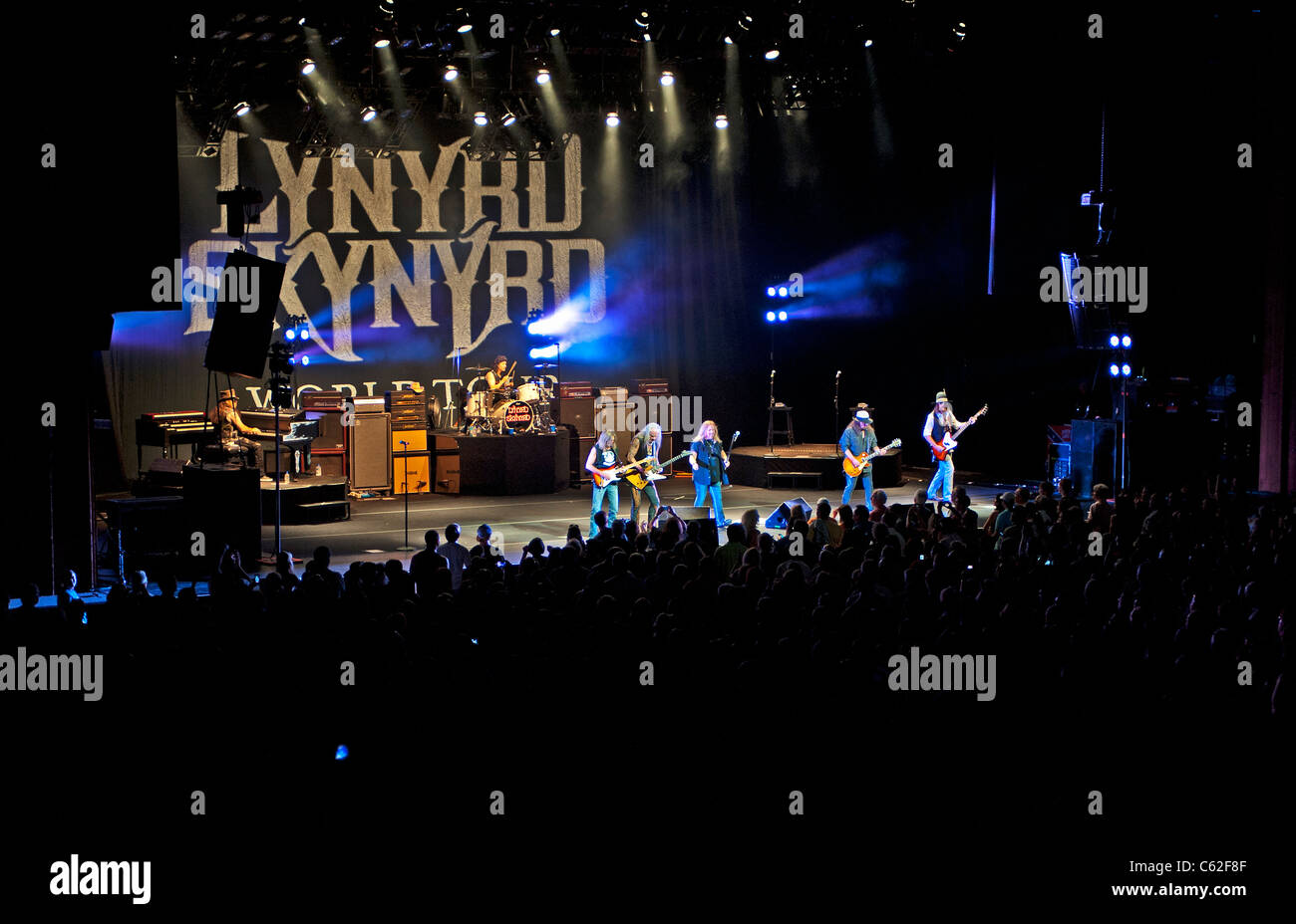 Lynyrd Synyrd in concert, a wide view of stage with logo and band members Stock Photo