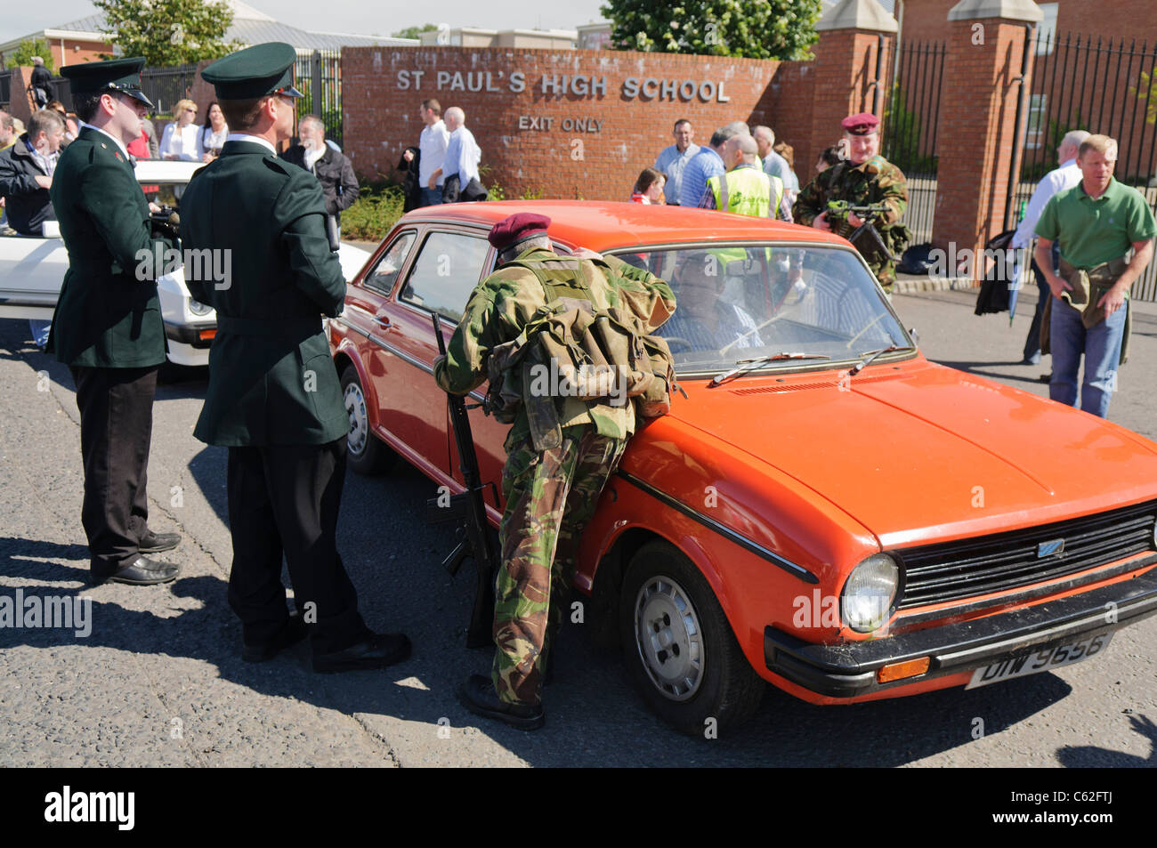 Men dressed in RUC and Army uniforms reenact a stop and search in Northern Ireland in the 1980s Stock Photo