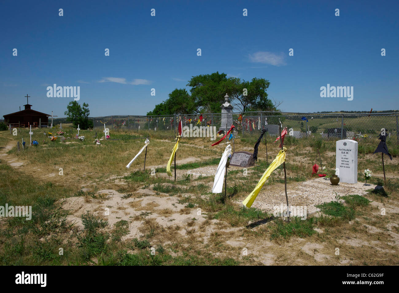 Ceremonial tobacco offerings on Wounded Knee mass grave fence on Oglala