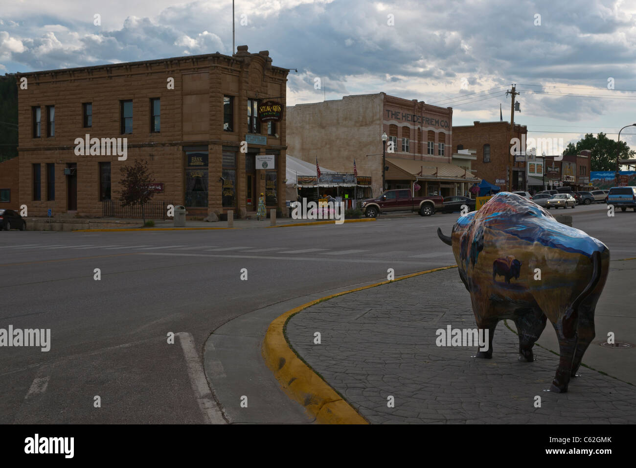 Low angle view of historic downtown with buffalo statue in foreground