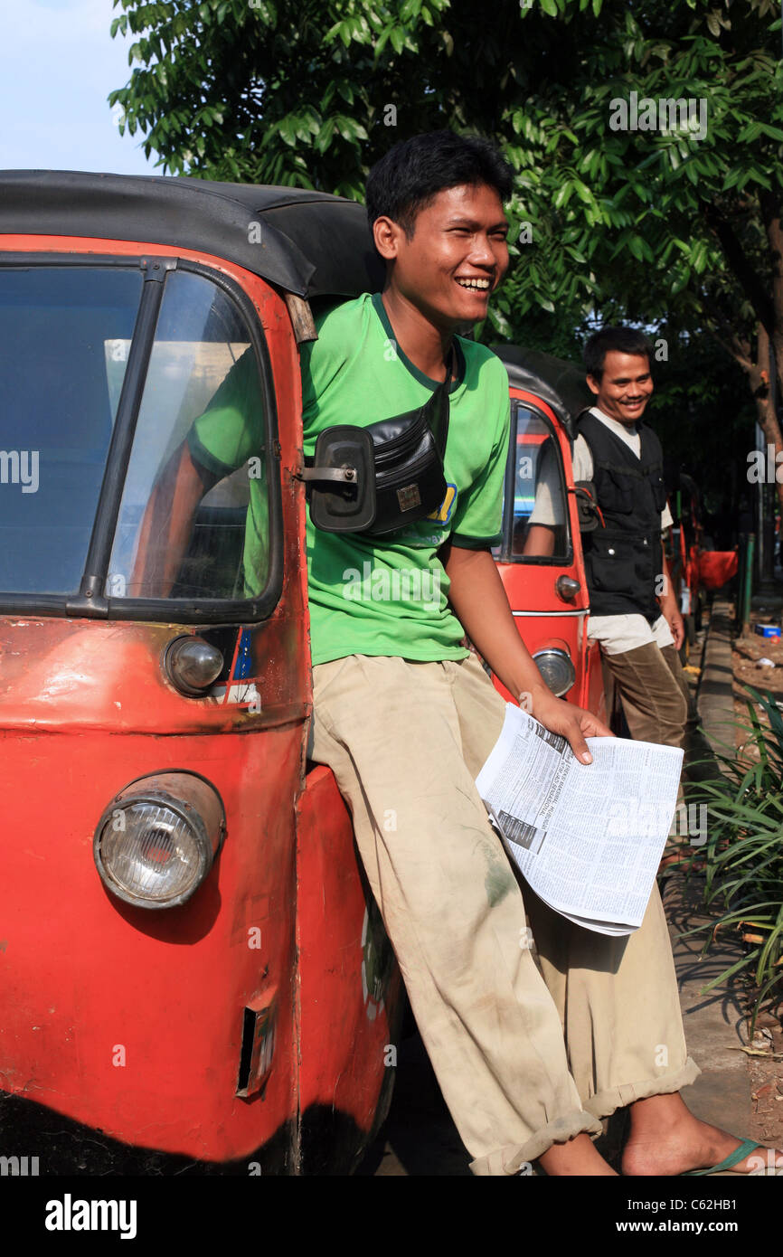 Happy bajaj drivers wait for passengers outside a mall on Jalan Wahid Hasim. Jakarta, Java, Indonesia, Southeast Asia, Asia Stock Photo