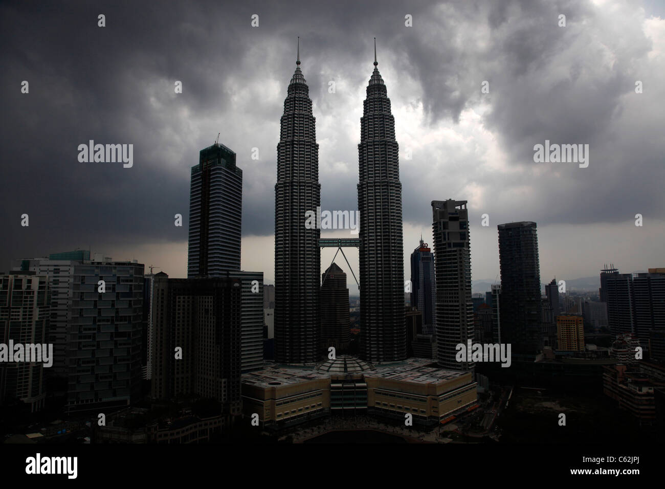 Silhouette of the Petronas Towers against a stormy sky in a storm, KLCC, Kuala Lumpur, Malaysia Stock Photo