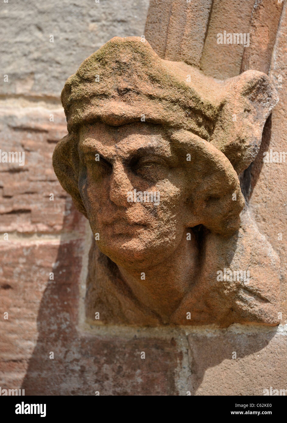 Sculpted male head at West doorway, Church of Saint John. Skirwith, Cumbria, England, United Kingdom, Europe. Stock Photo
