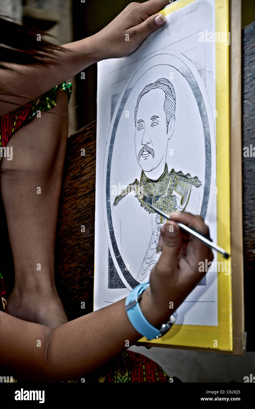 Artist sketching a gold inlay portrait of the late Thailand King Rama V. Thailand S. E. Asia Stock Photo