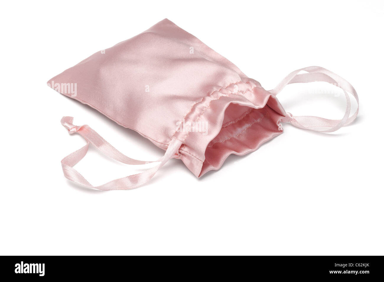 Soft pink satin sachet pouch on white background Stock Photo