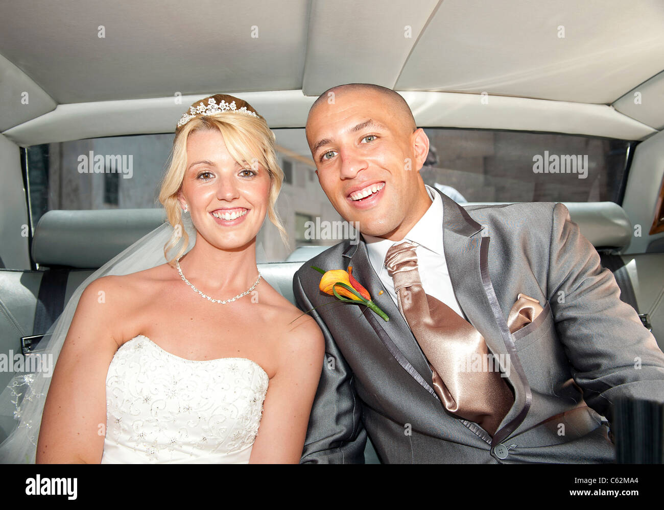 Bride and Groom inside the wedding car Stock Photo - Alamy