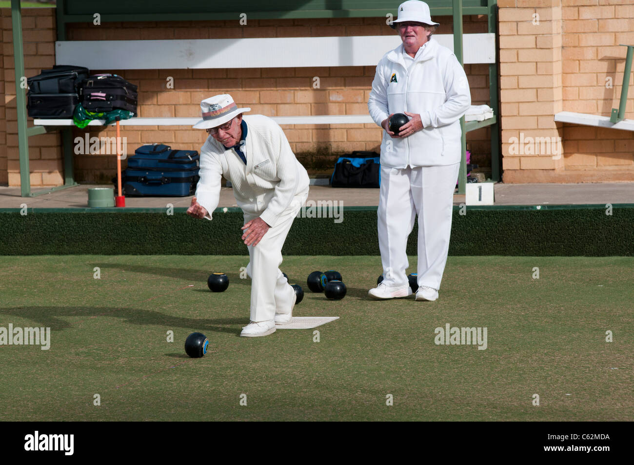 Elderly people playing lawn bowls in South Australia Stock Photo