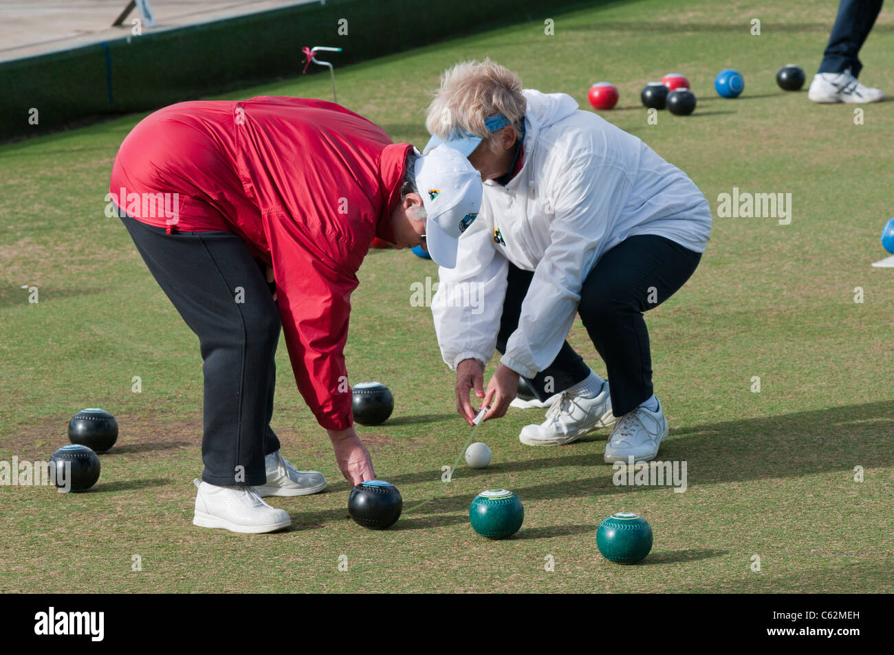 Elderly people playing lawn bowls in South Australia Stock Photo
