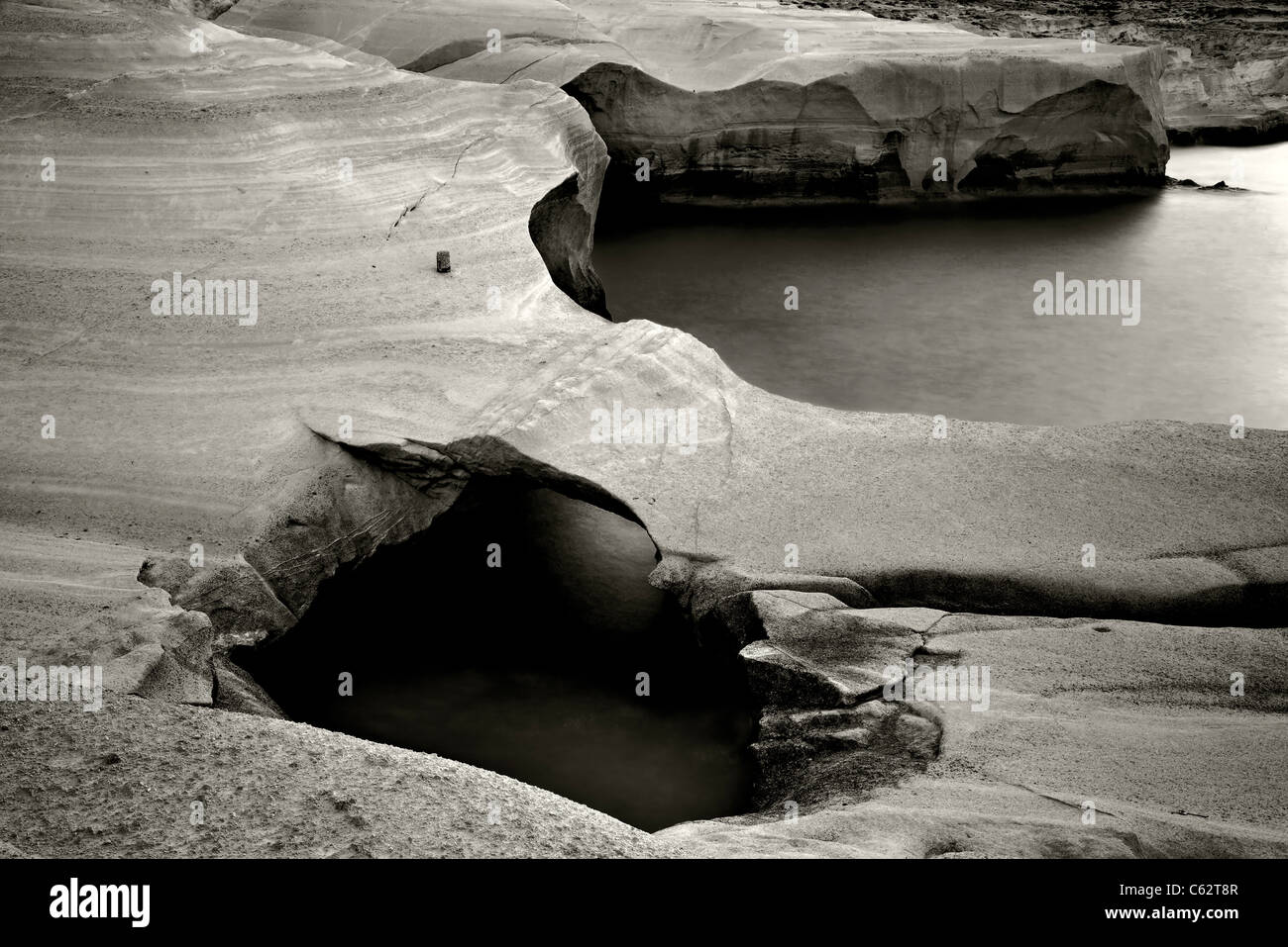 Milos island, volcanic rocks in Sarakiniko beach (slow shutter speed-black & white version). Stock Photo