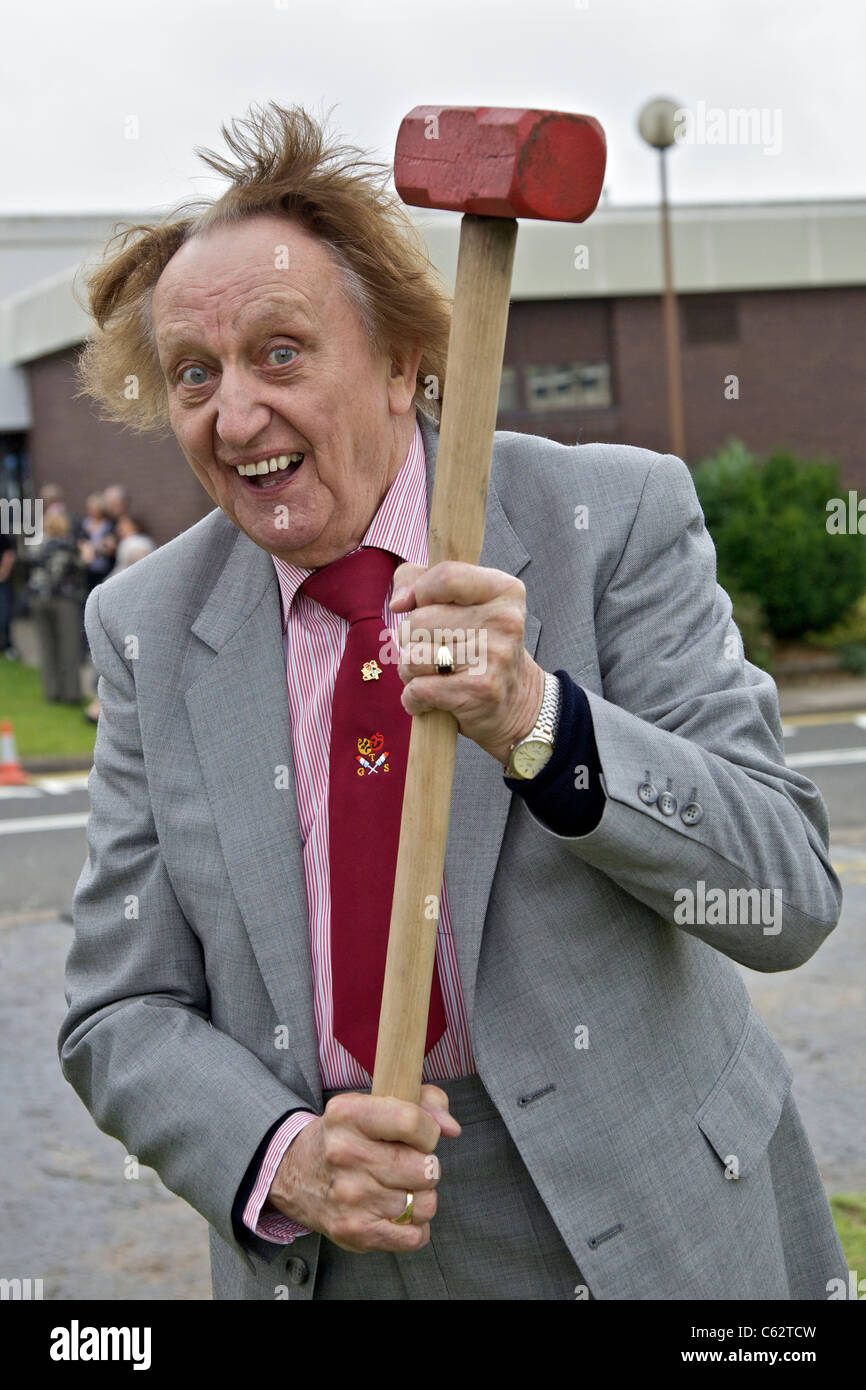 Comedian Ken Dodd with a sledgehammer...pictured at a tree planting