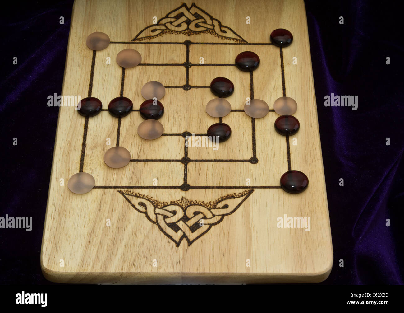Ludus latrunculorum, latrunculi, or simply latrones a two-player strategy board game played with dice, throughout the Roman Empire at Northwich Medieval Festival Verdin Park, Northwich, UK Stock Photo