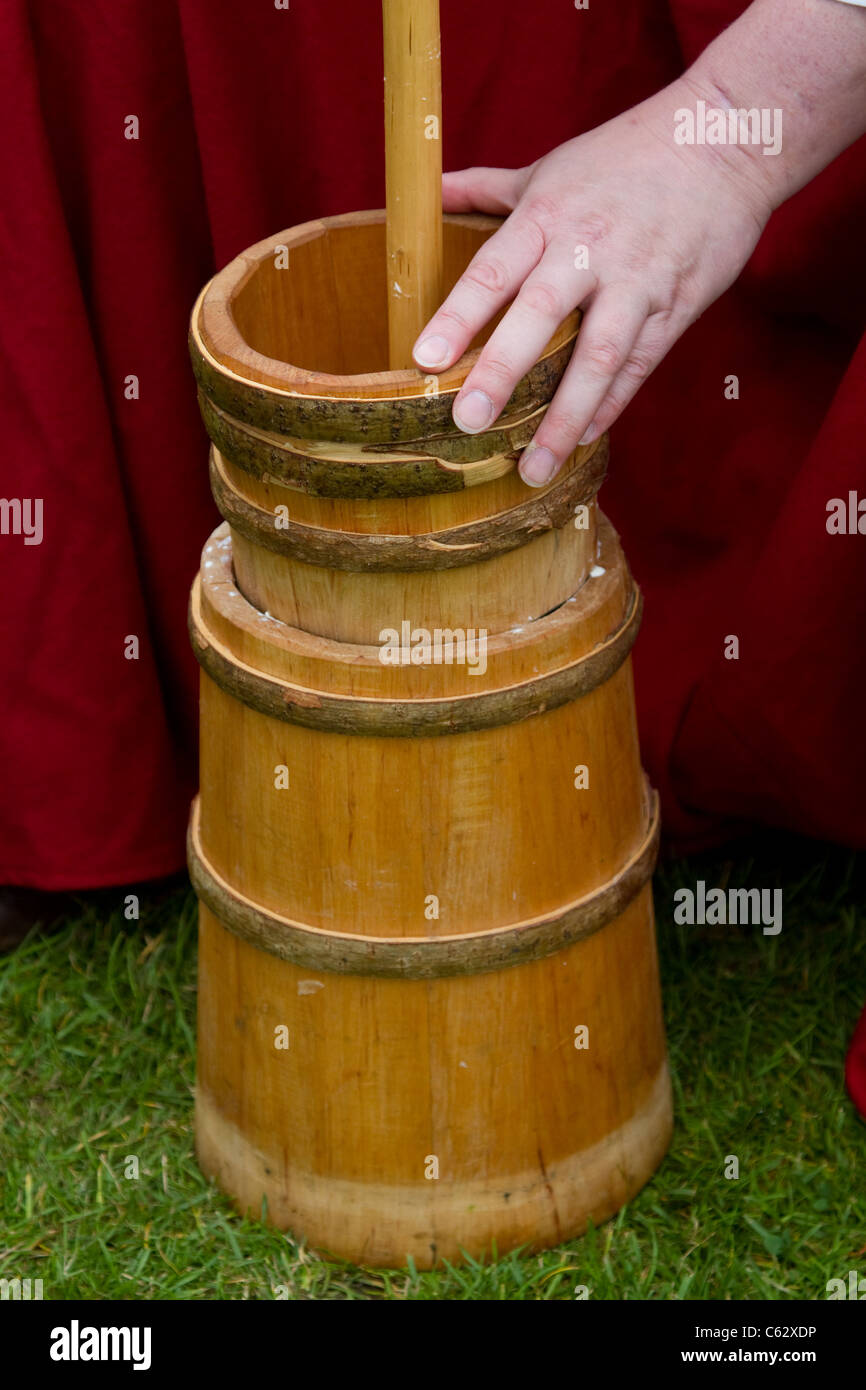 Churning Butter at the Northwich Medieval Festival Verdin Park, Northwich 13th August 2011 - 14th August 2011 Stock Photo