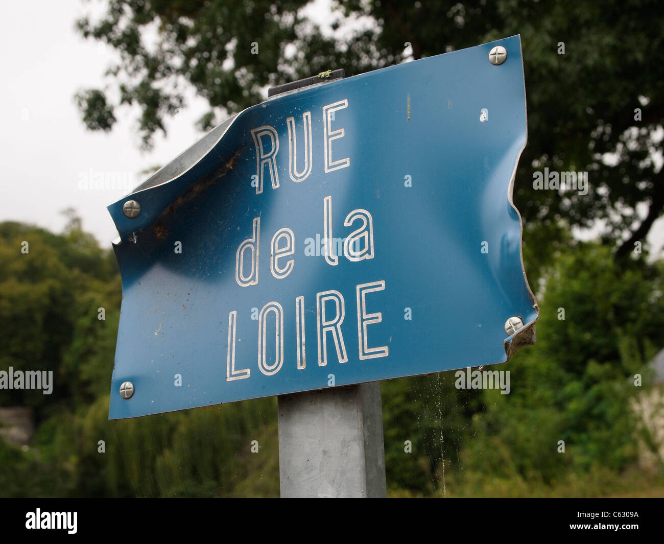 Battered Rue de la Loire street name sign in Ussé, Loire valley, France Stock Photo