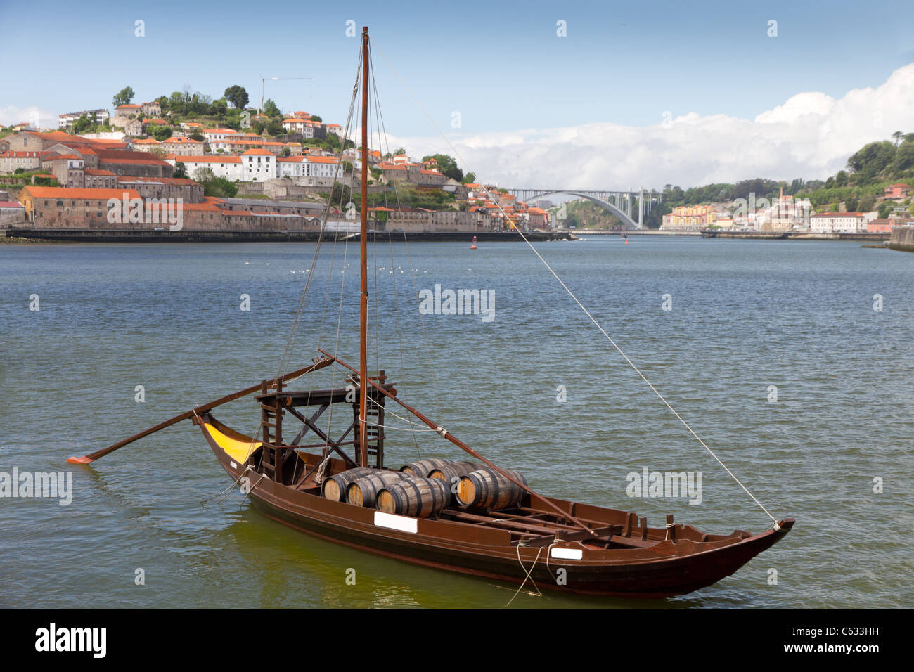 Port wine storage warehouses and transport boats at river Duoro in Vila Nova de Gaia opposite