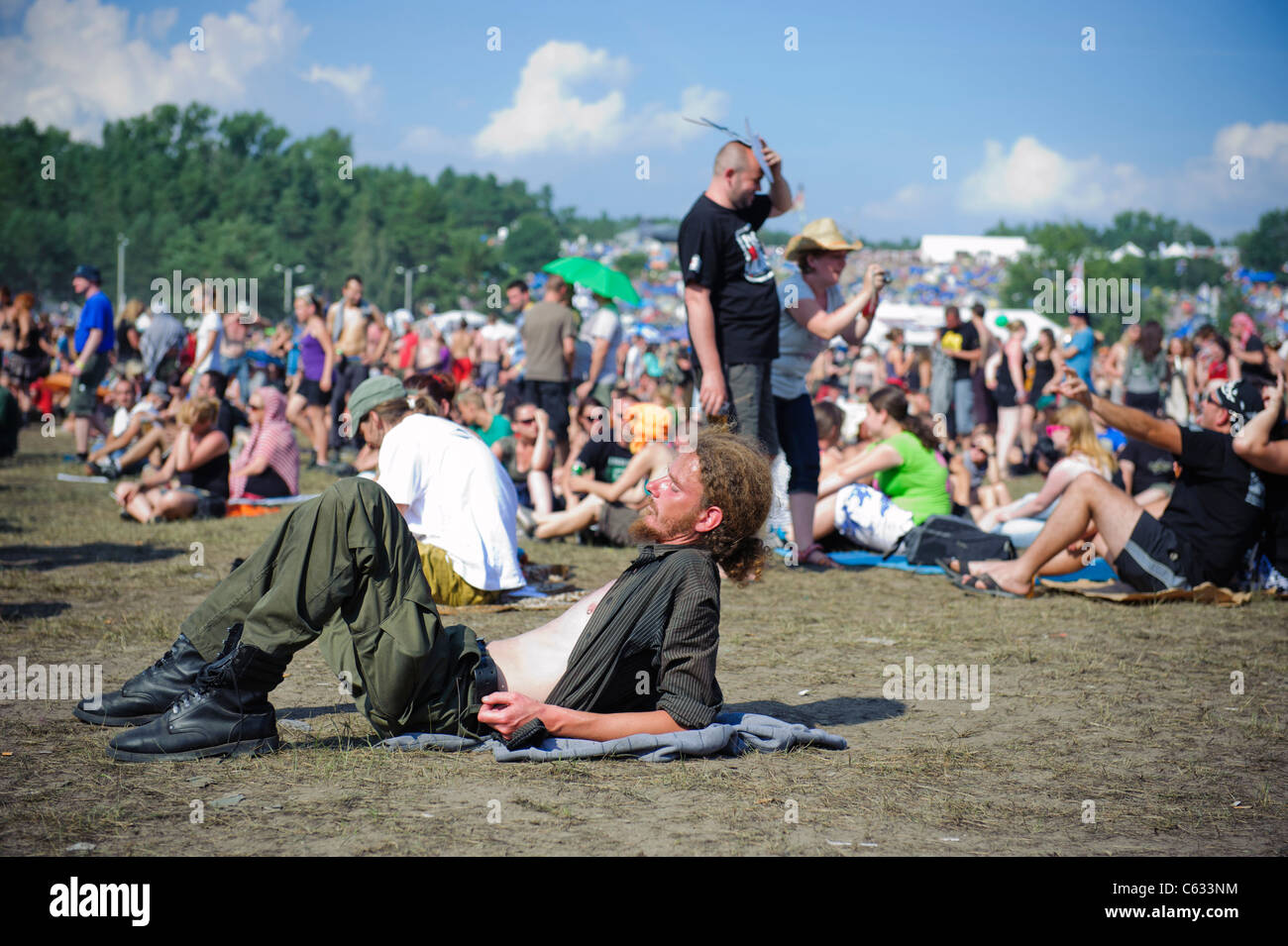 people enjoying the Przystanek Woodstock - Europe's largest open air festival in Kostrzyn, Poland Stock Photo