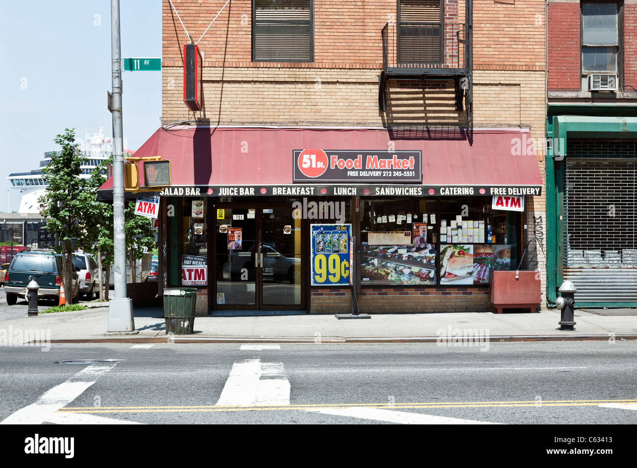 New York City corner deli delicatessen in old building on a beautiful