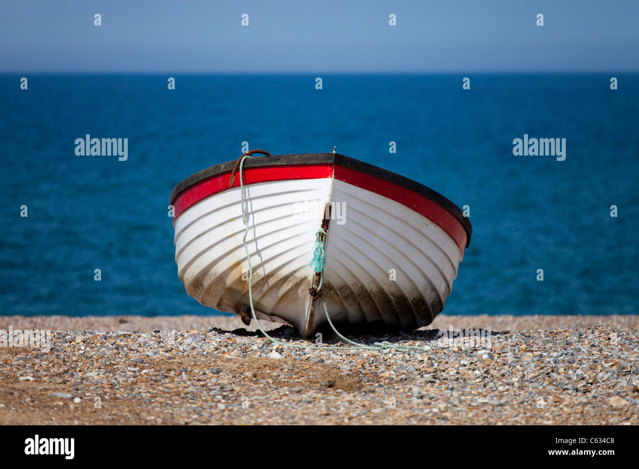 A rowing boat on the beach at Cley-next-the-Sea in North Norfolk, UK Stock Photo
