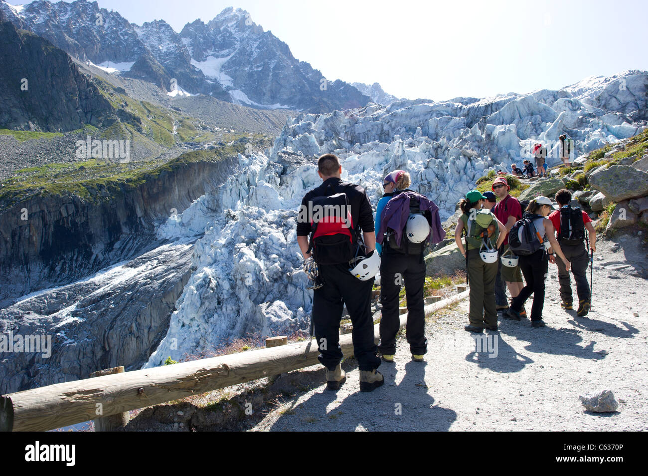 A group of climbers looking at the seracs on snout of the Glacier D'Argentiere, in the Chamonix Valley, France. Stock Photo