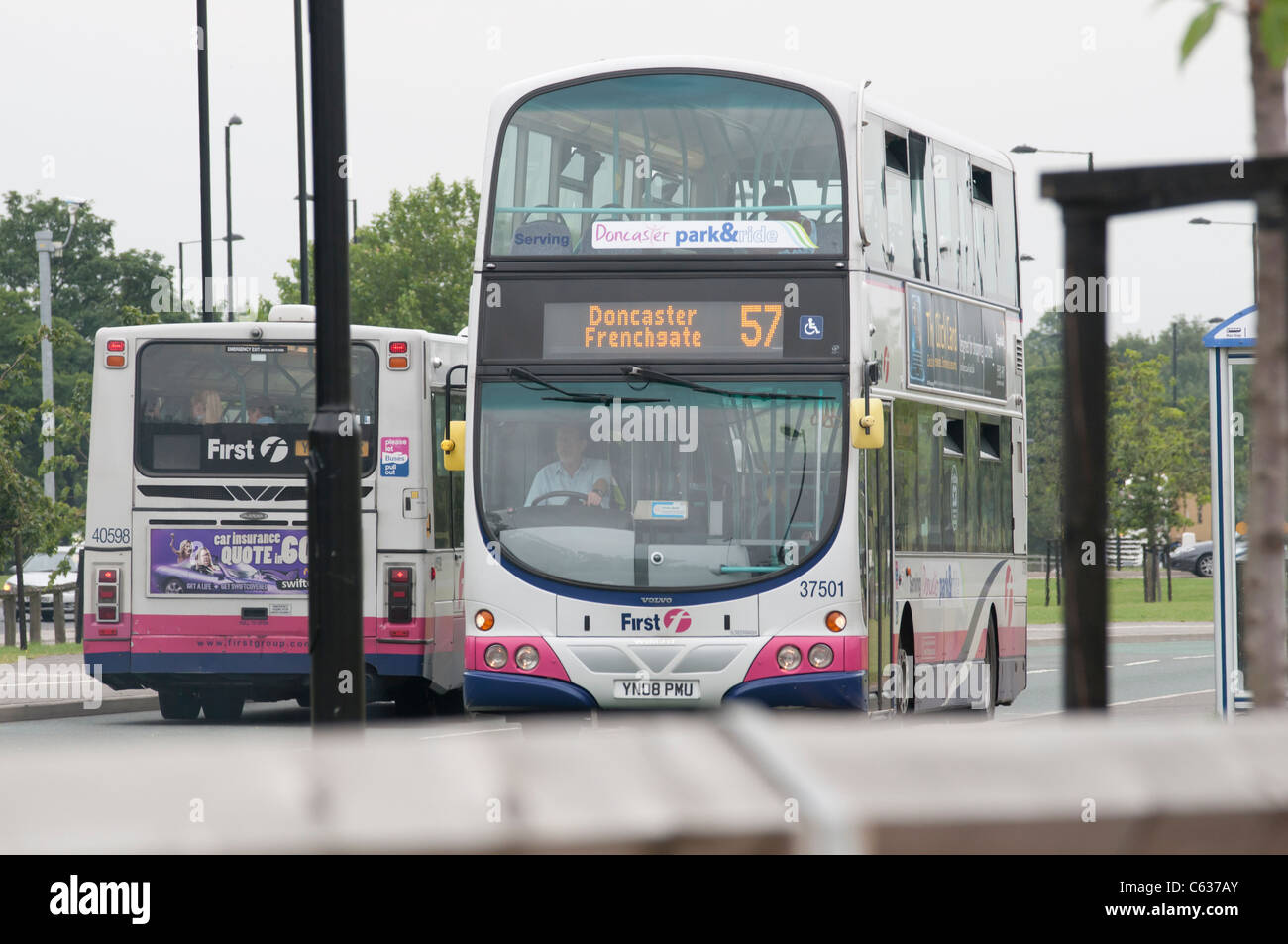 First bus at a bus stop on Bawtry Road in Doncaster, Yorkshire Stock Photo