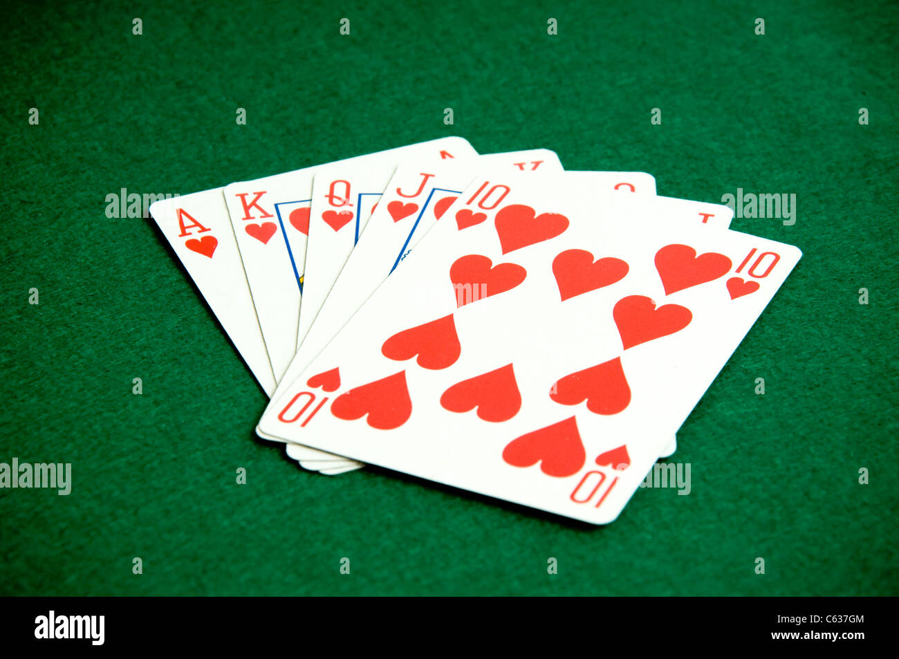 Playing cards on green baccground, heart poker Stock Photo