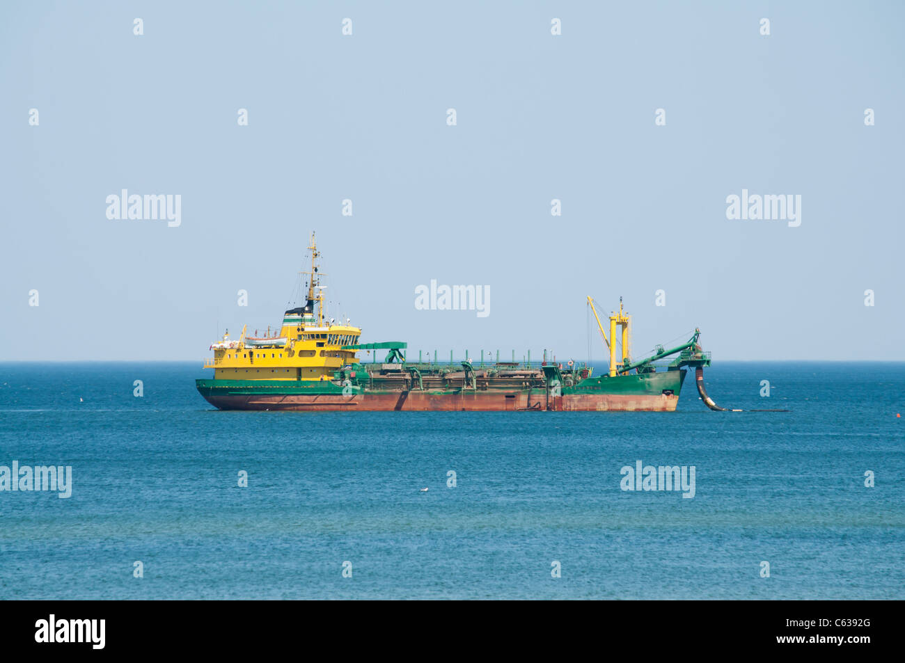 dredger ship working at sea Stock Photo