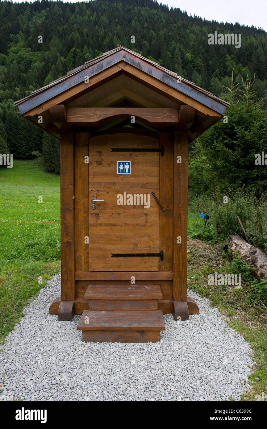 An outside public toilet in the style of a French mountain chalet. These are all along the Chamonix Valley, in the French Alps. Stock Photo