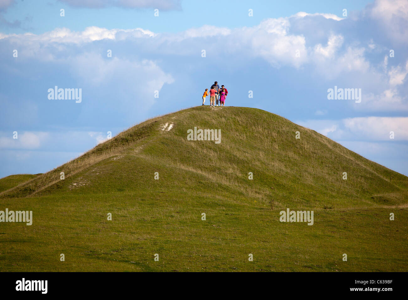 Family on top of Milk Hill Alton Barnes Wiltshire Stock Photo Alamy
