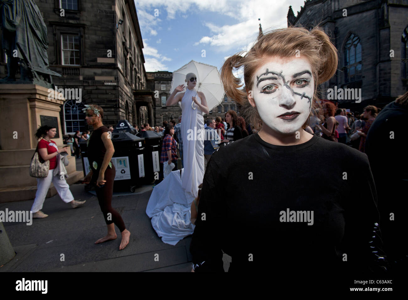 Fringe performers promote their shows on Edinburgh's Royal Mile, during