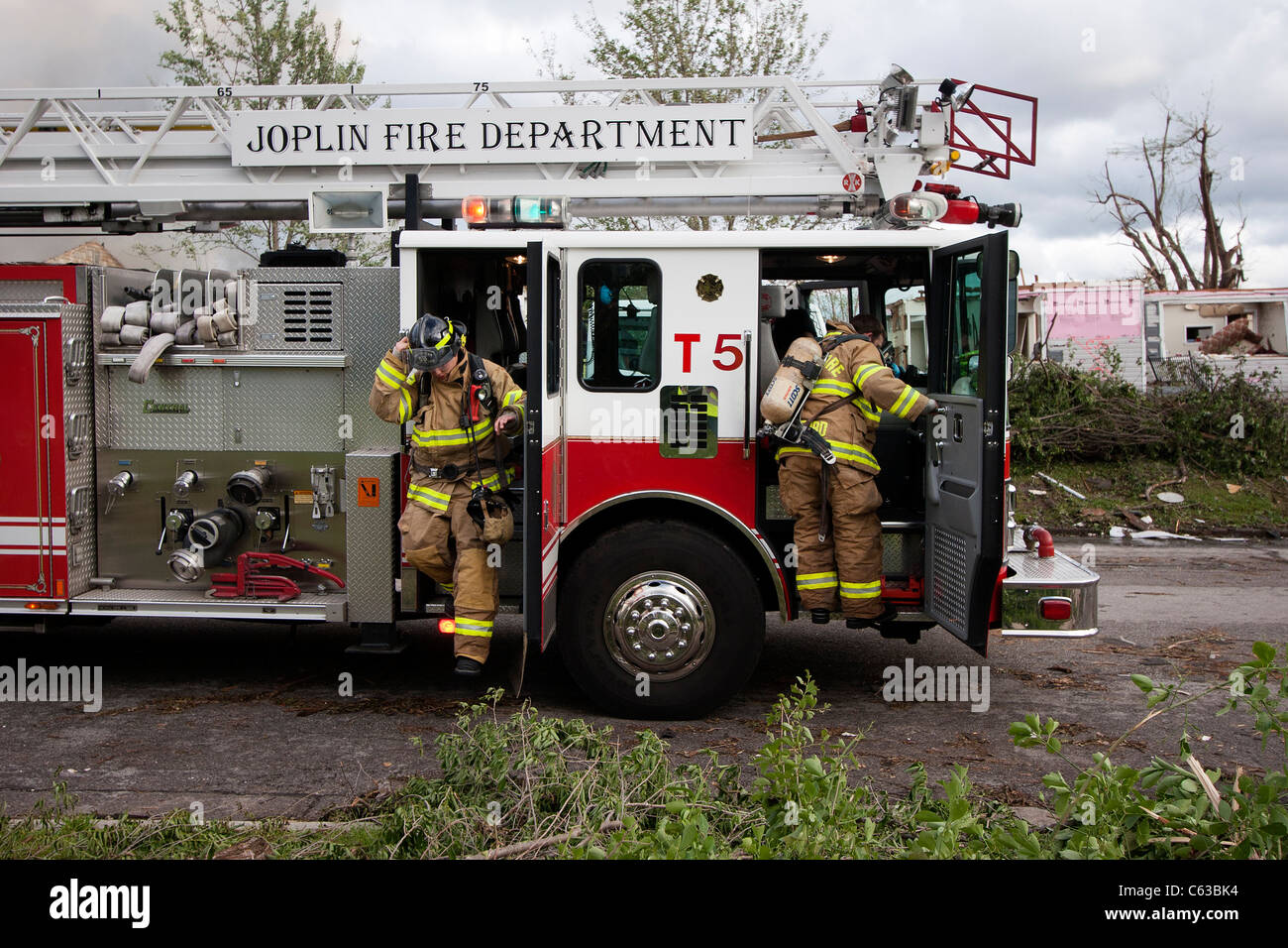 Firefighters battle a home blaze in Joplin, Missouri, May 25, 2011. Stock Photo