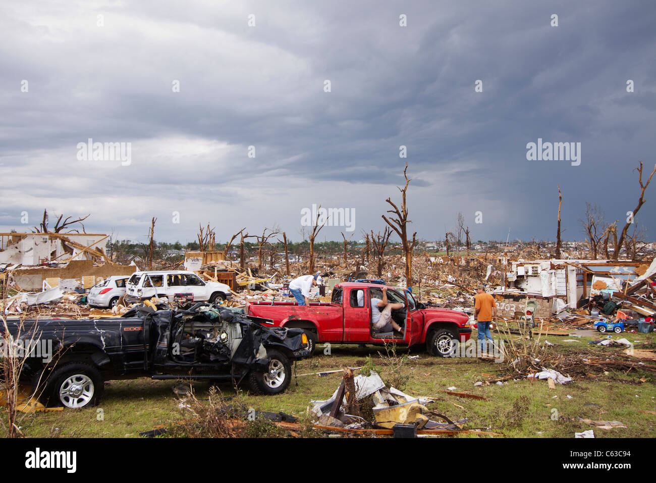 Volunteers help to clear a field of debris in Joplin, Missouri, May 25, 2011. Stock Photo
