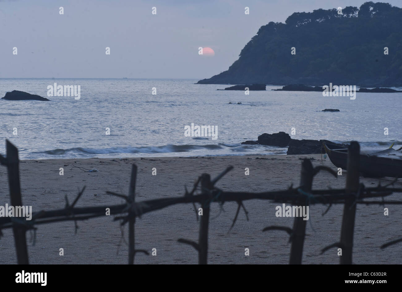 Sunset at Karwar beach with a fishing boat-North Kanara-Karnataka-India - No-3. Stock Photo