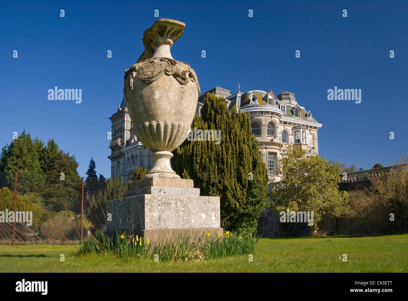 Old gothic style mansion once occupied by royalty with huge vase in the foreground Stock Photo