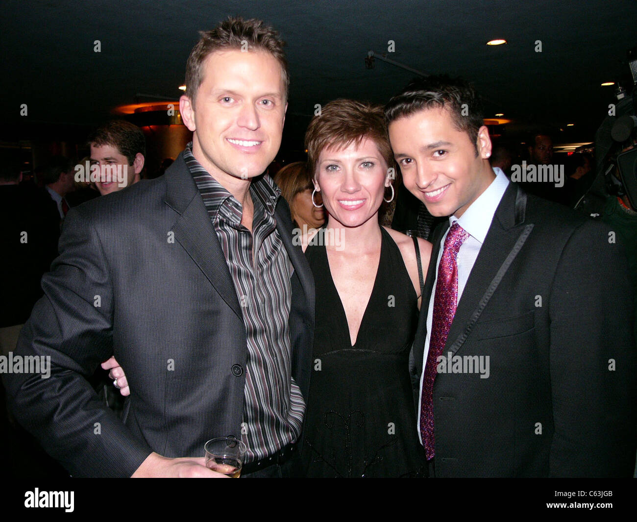 Kelly Perdew, Therisa Kennedy, and Jai Rodriguez at the after party for THE APPRENTICE, NY, December 16, 2004. (photo: Rob Rich/Everett Collection) Stock Photo