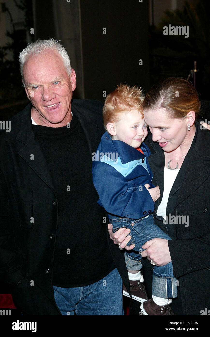 Malcolm McDowell with wife and son at arrivals for AEON FLUX Premiere