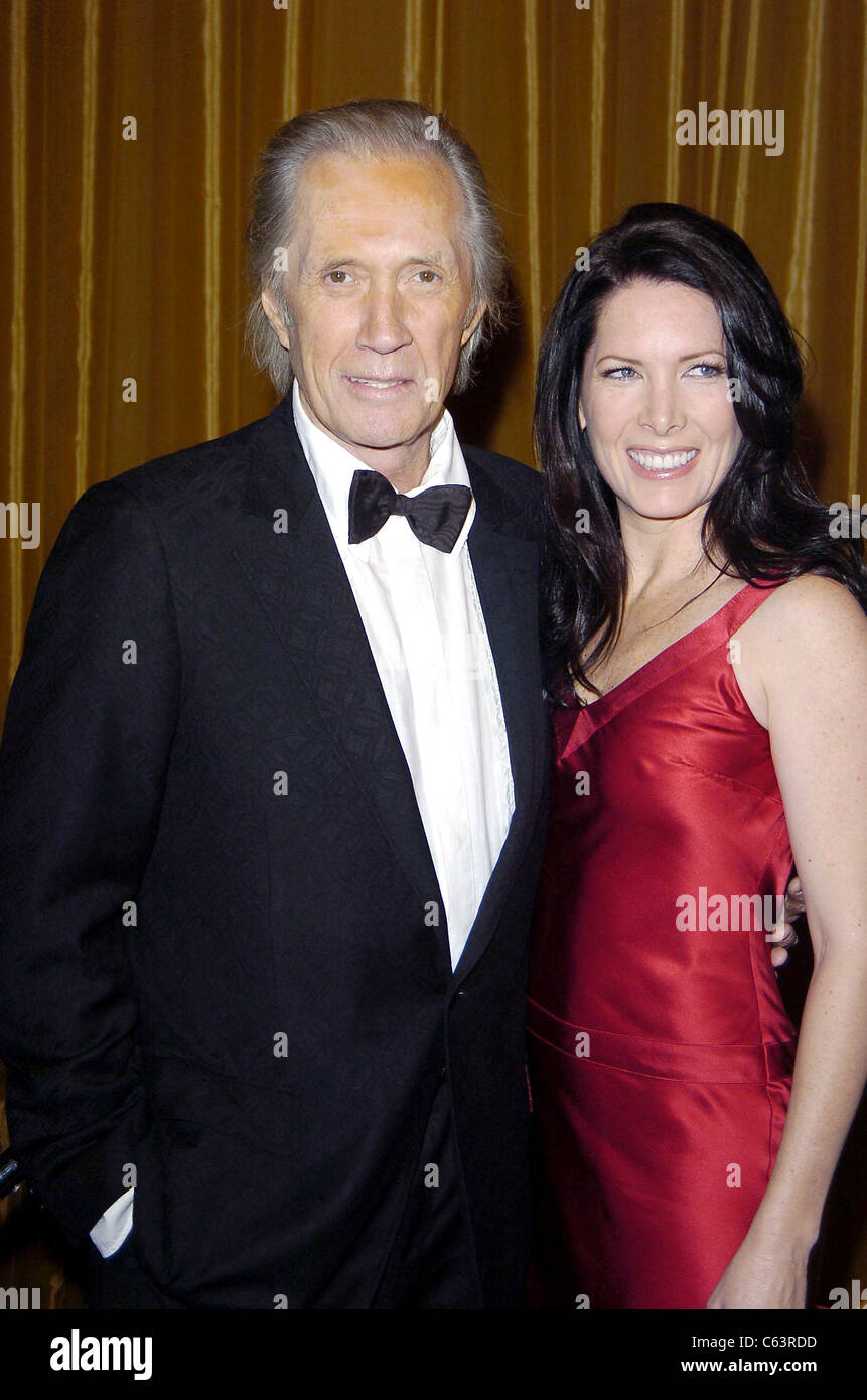 David Carradine and wife at arrivals for 57th Annual Directors Guild of America Awards, Beverly Hilton Hotel, Los Angeles, CA, Saturday, January 29, 2005. Photo by: Michael Germana/Everett Collection Stock Photo