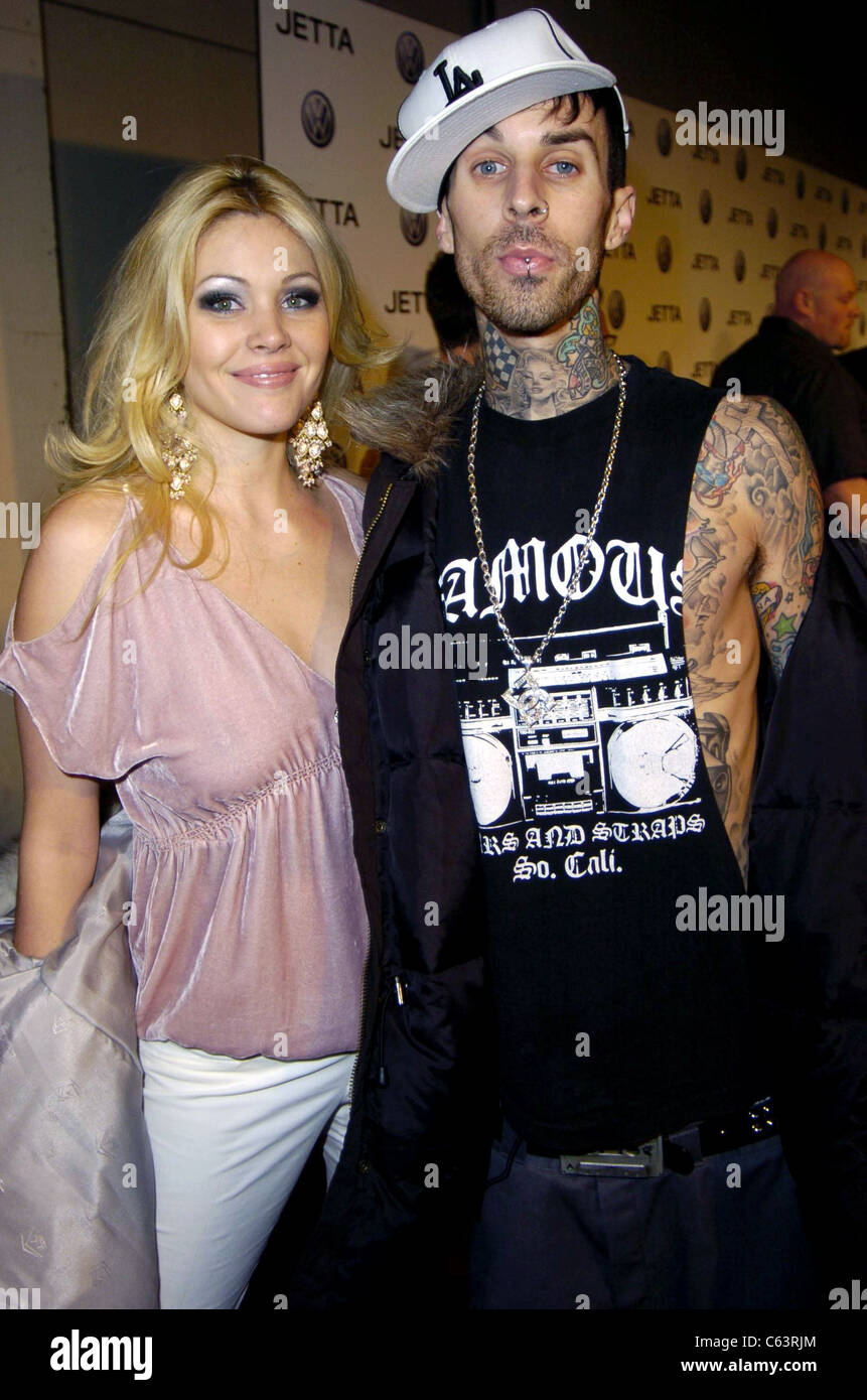 Actress Shanna Moakler and her husband, recording artist Travis Barker pose for photographers, at the launch of the 2005 Volkswagen Jetta at The Lot, Los Angeles, CA January 05, 2005. Photo by: Michael Germana/Everett Collection Stock Photo