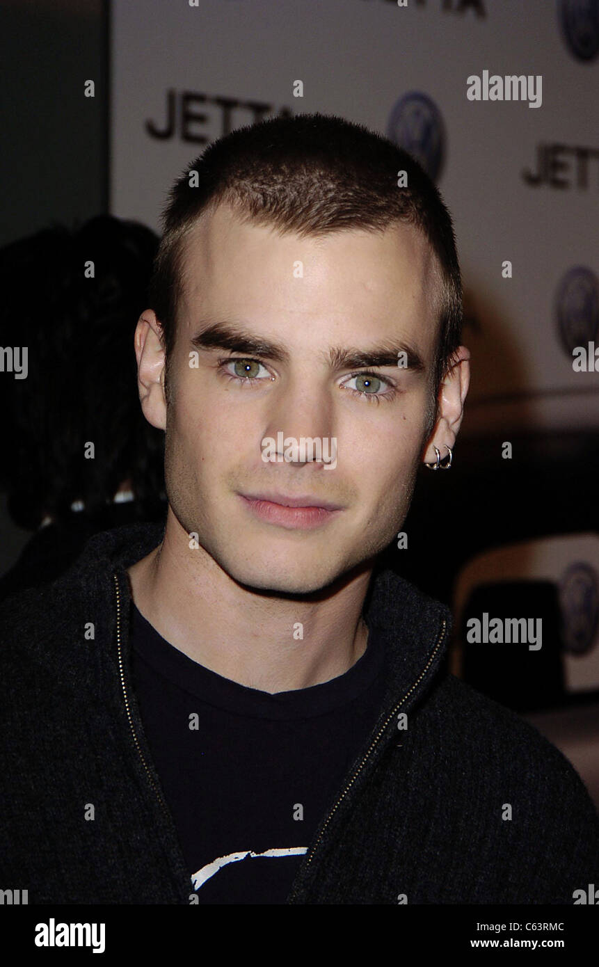 David Gallagher poses for photographers, at the launch of the 2005 Volkswagen Jetta at The Lot, Los Angeles, CA January 05, 2005. Photo by: Michael Germana/Everett Collection Stock Photo