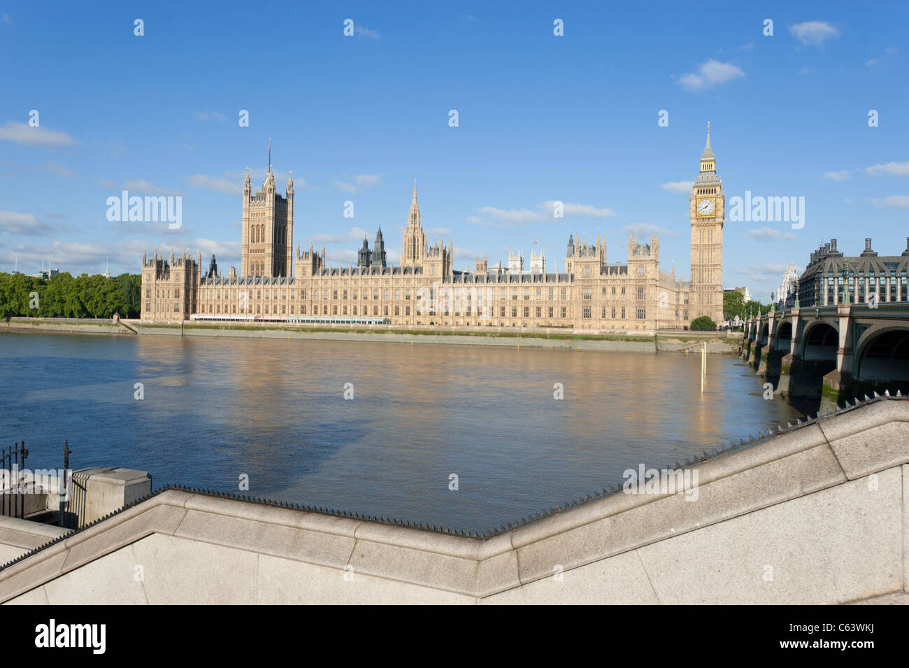 The Houses of Parliament in London, England, UK, beside the River Thames. As seen from the opposite bank. Stock Photo
