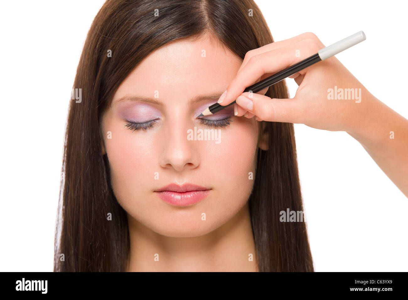 Professional makeup model portrait artist make eye lines using pencil