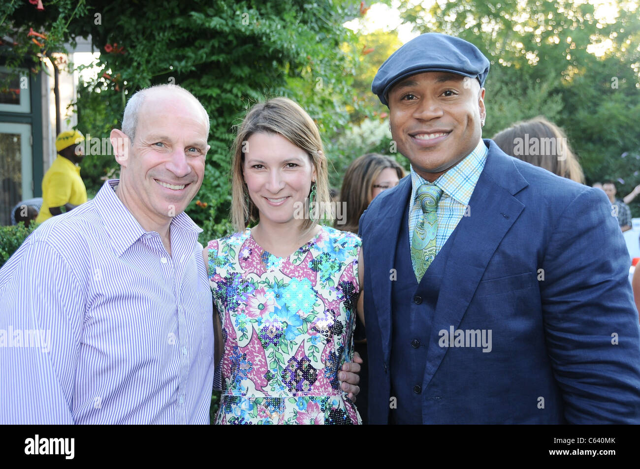 Jonathan Tisch, Lizzie Tisch, LL Cool J at a public appearance for Red Hot Red Cross Cocktails, , Sagaponack, NY August 7, 2010. Photo By: Rob Rich/Everett Collection Stock Photo