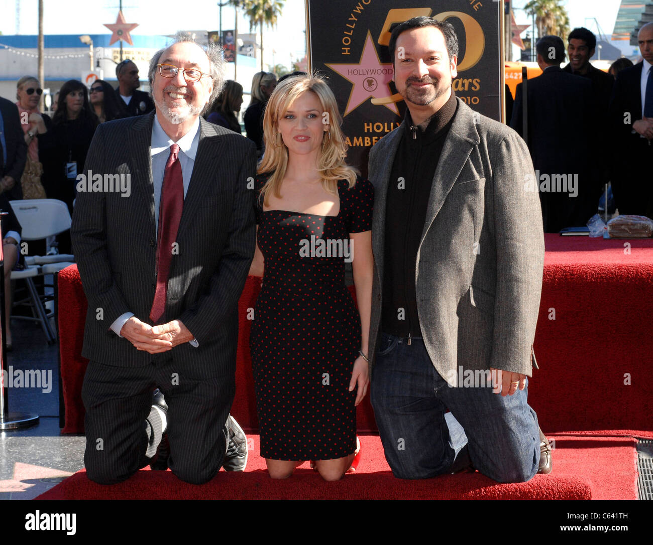 James L. Brooks, Reese Witherspoon, Jim Mangold at the induction ceremony for Star on the Hollywood Walk of Fame Ceremony for Reese Witherspoon, Hollywood Boulevard, Los Angeles, CA December 1, 2010. Photo By: Elizabeth Goodenough/Everett Collection Stock Photo