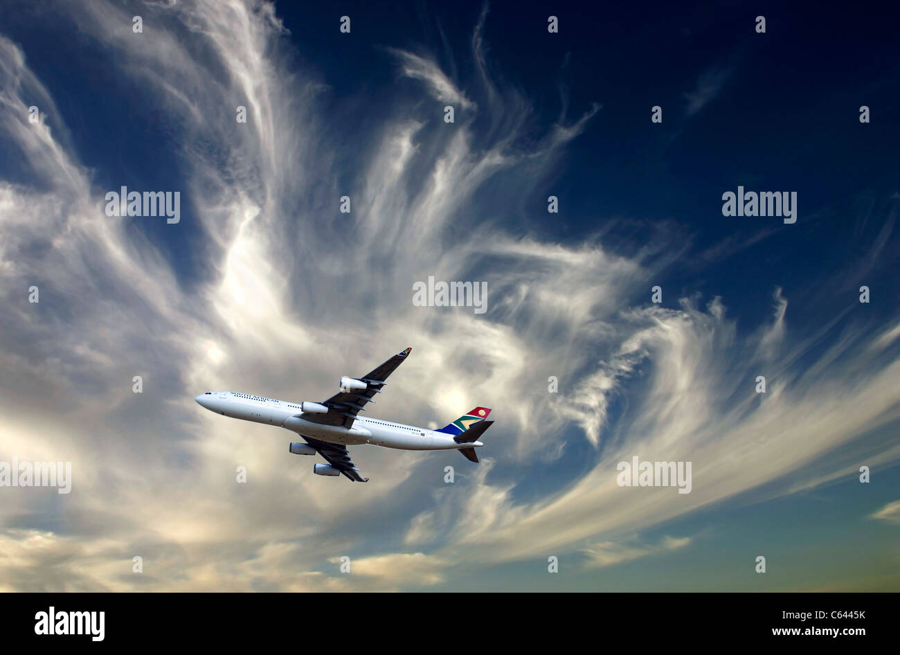 South African Airbus A340-600 jet aircraft against cloudy sky Stock Photo