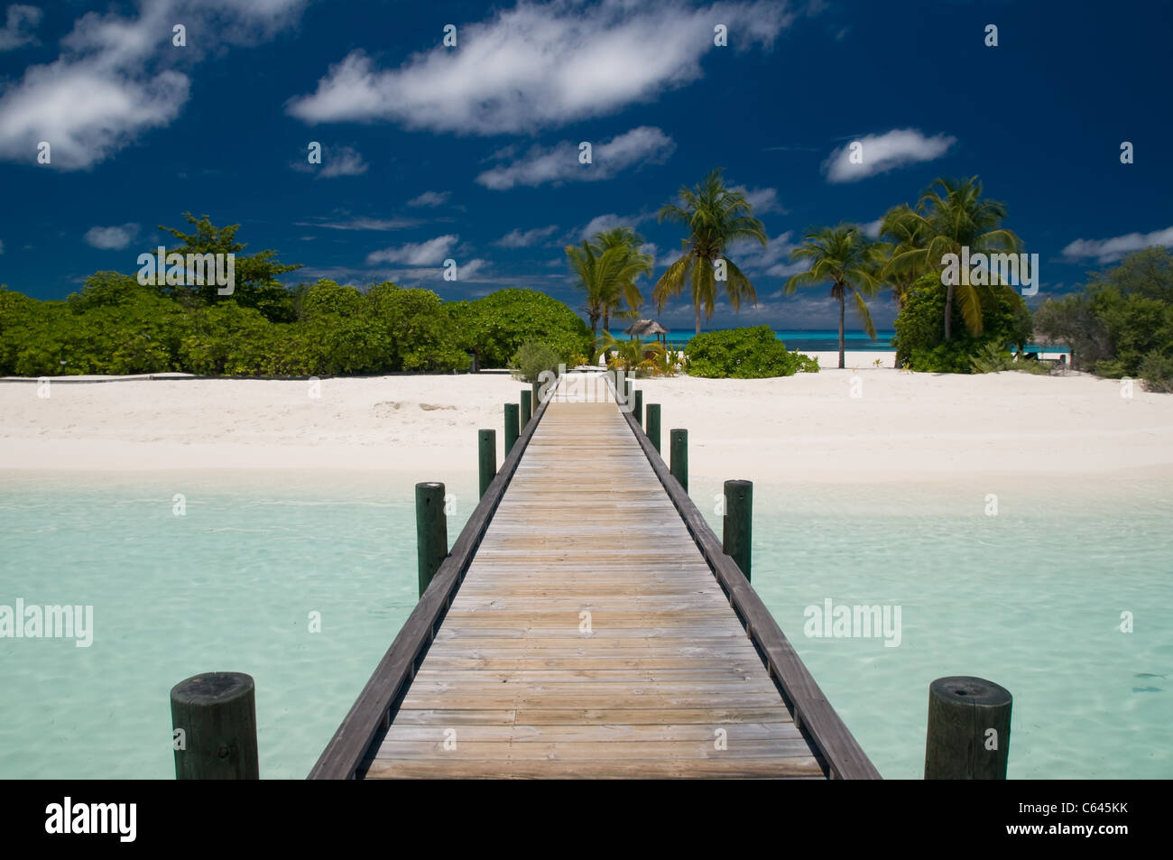 jetty leading to a tropical island Stock Photo - Alamy