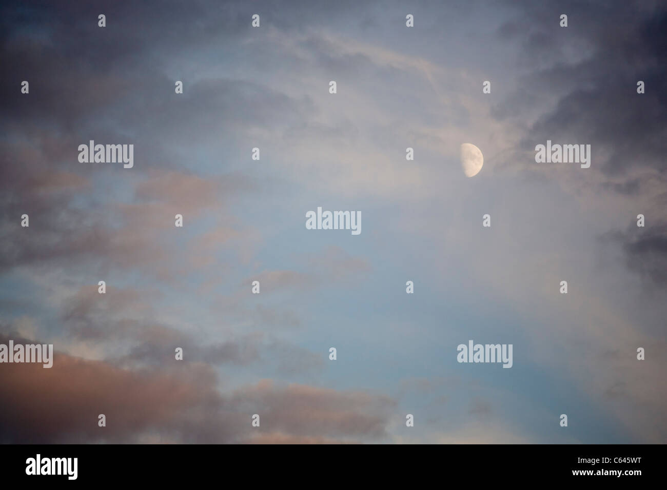 Evening skyscape with dramatic clouds and moon Stock Photo - Alamy