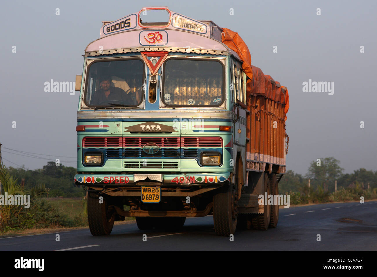 Indian Tata Truck at sunset on the national highway to West Bengal India Stock Photo