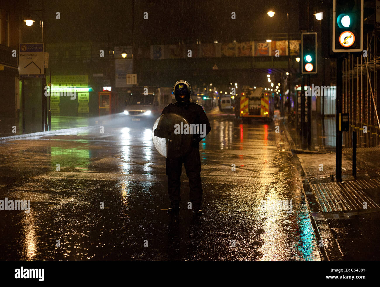 Police cordon the centre of Brixton in London after looters ransacked and burnt shops in the area. Stock Photo