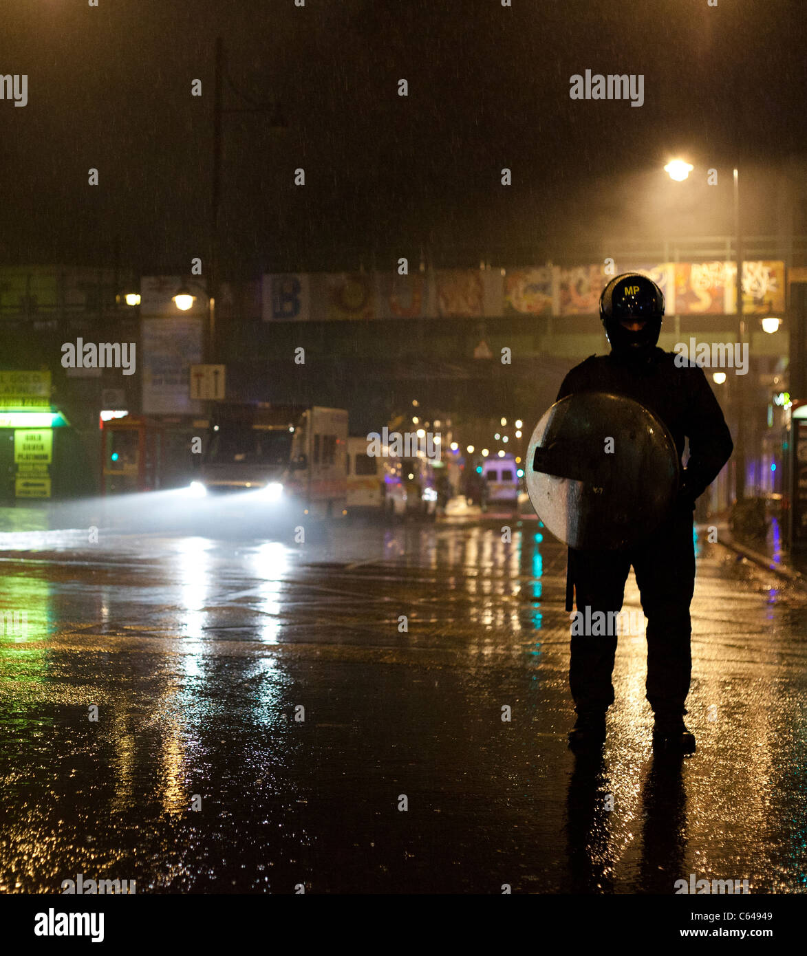 Police cordon the centre of Brixton in London after looters ransacked and burnt shops in the area. Stock Photo