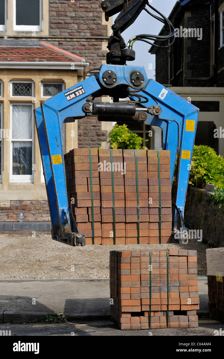 Crane delivering block paving Stock Photo